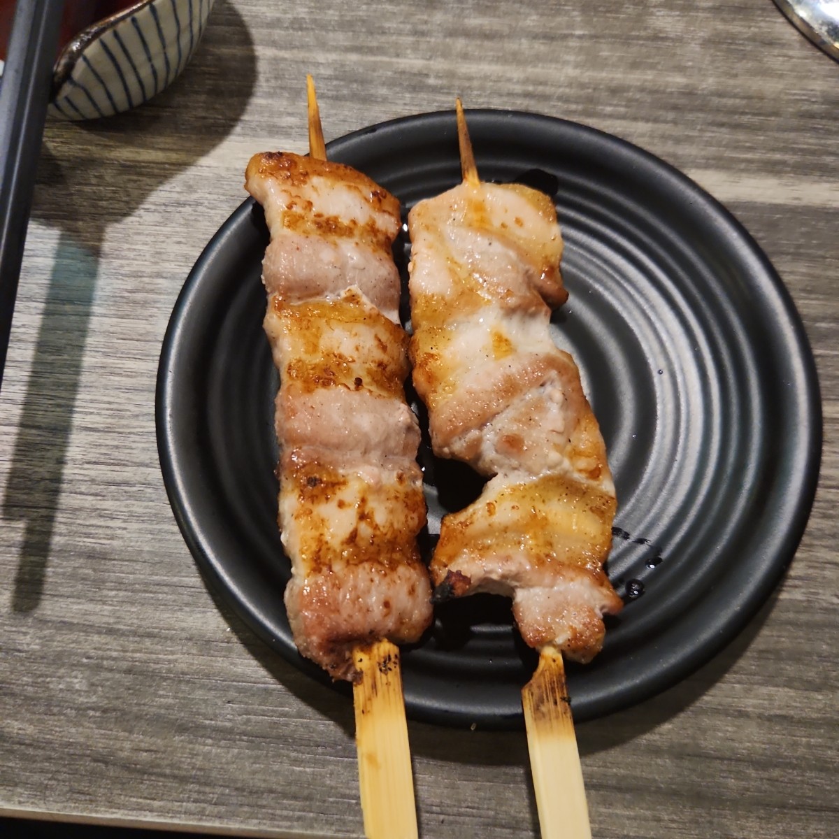 Meal image of Tanzen Izakaya: Pork Belly skewers shot by blacktaiko
