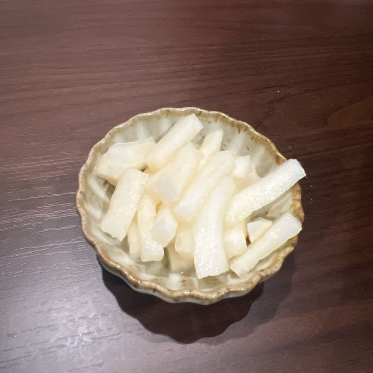 Meal image of 炙火居酒屋: 招待小菜 醃蘿蔔 shot by 七咪