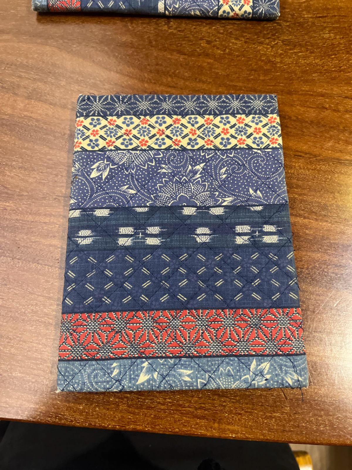 Menu image of 子梧桐 日本傳統手工烏龍麵: 菜單長這樣我不知道還以為是墊碗的🤣 shot by Qoo